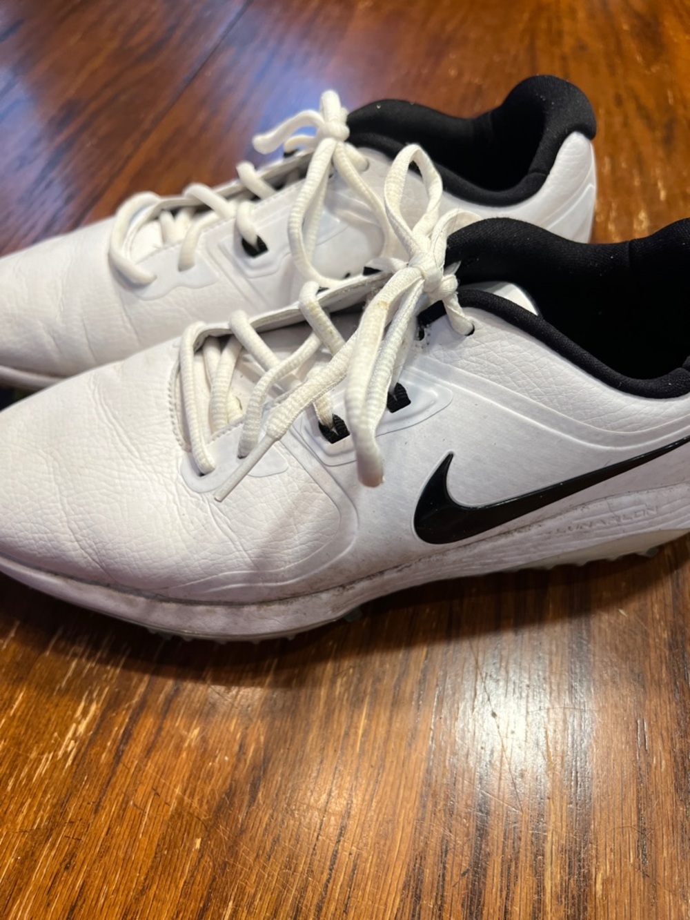 Nike Men's White Athletic Shoes with Black Swoosh